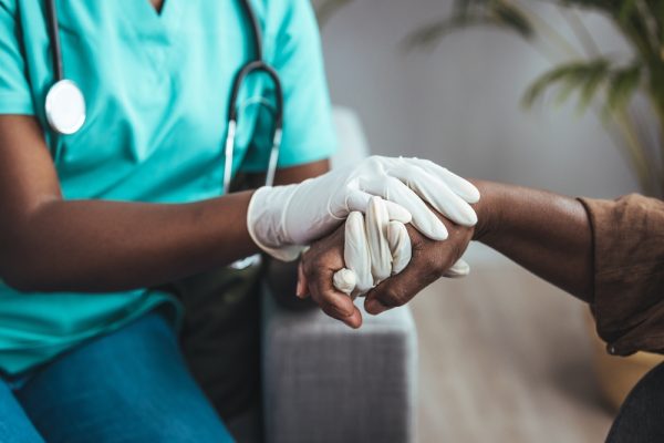 Cropped,Shot,Of,A,Female,Nurse,Hold,Her,Senior,Patient's