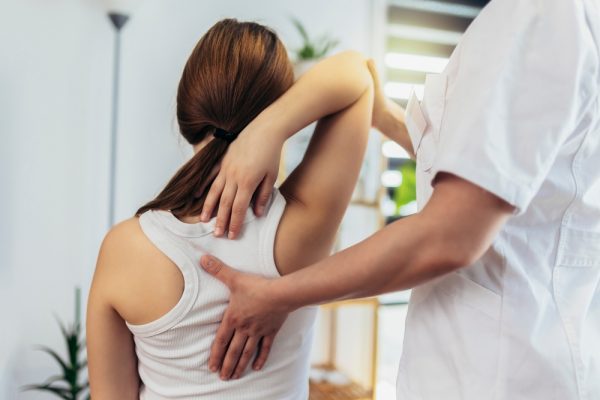 Teen,Girl,Having,Chiropractic,Back,Adjustment.,Osteopathy,,Physiotherapy,,Kinesiology.,Bad